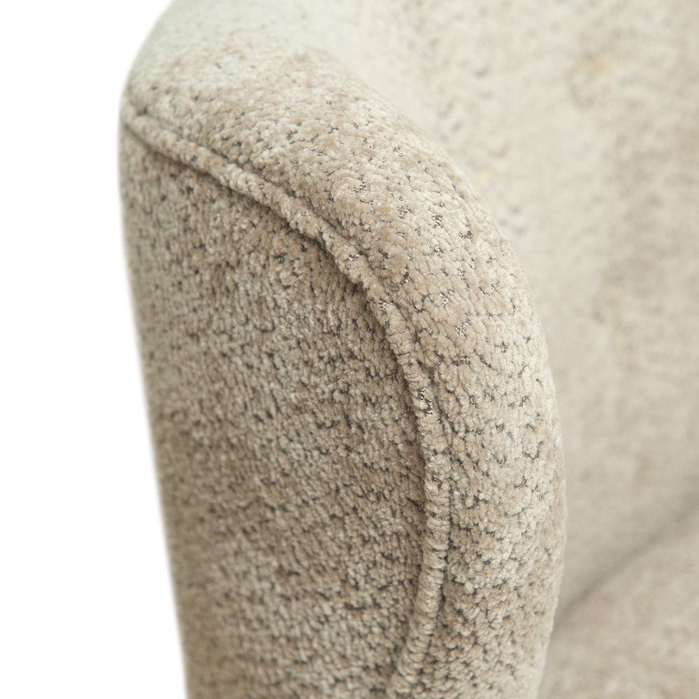 Generously proportioned and upholstered in warm camel fabric, this loveseat-