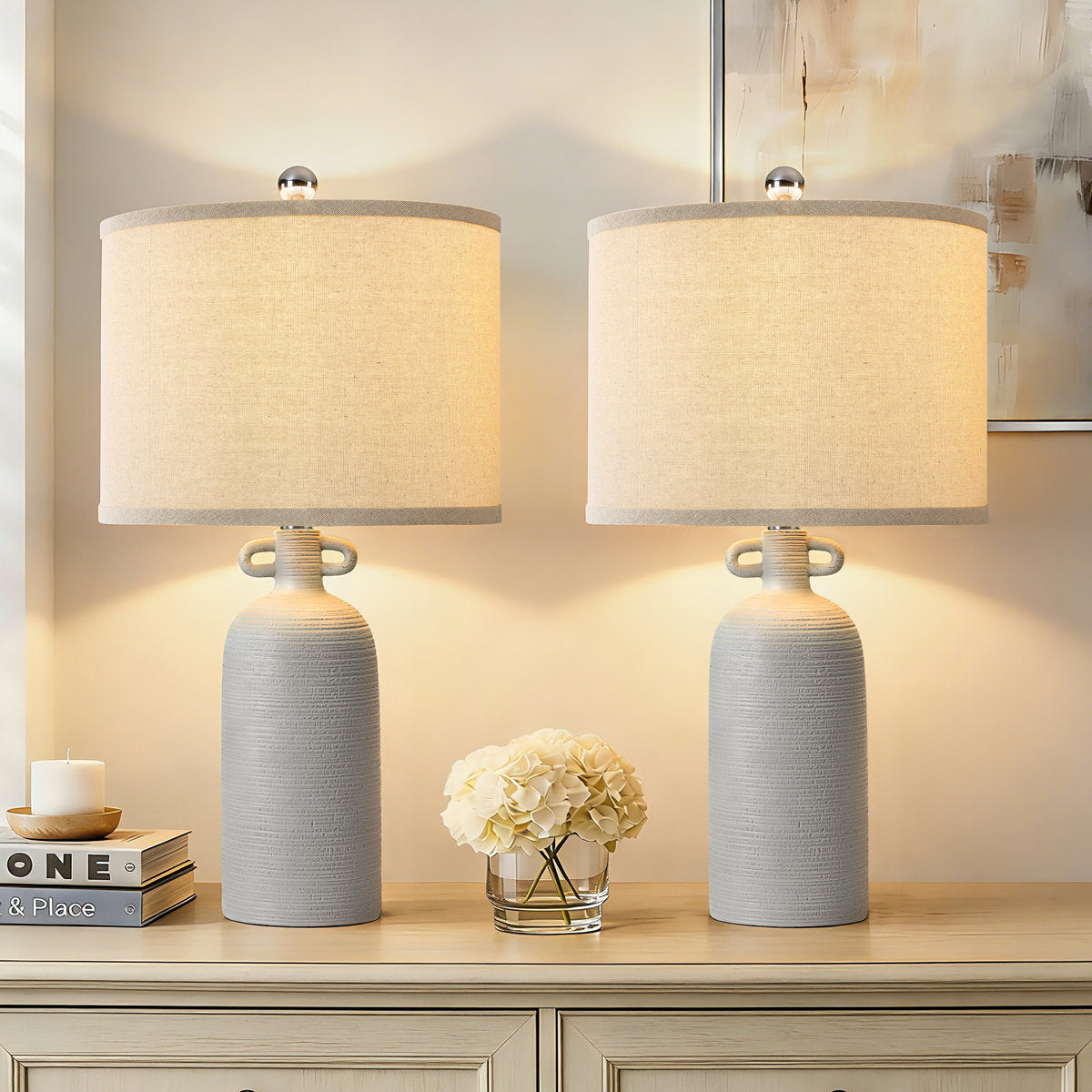 Gray Textured Ceramic Dimmable Table Lamps — lit pair on a console