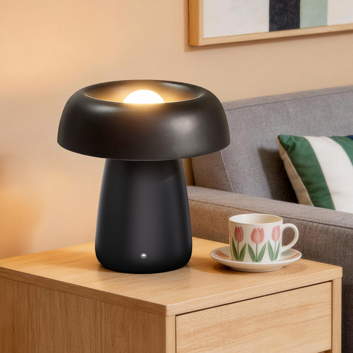 Black Ceramic Rechargeable LED Table Lamp — lit on a wooden side table