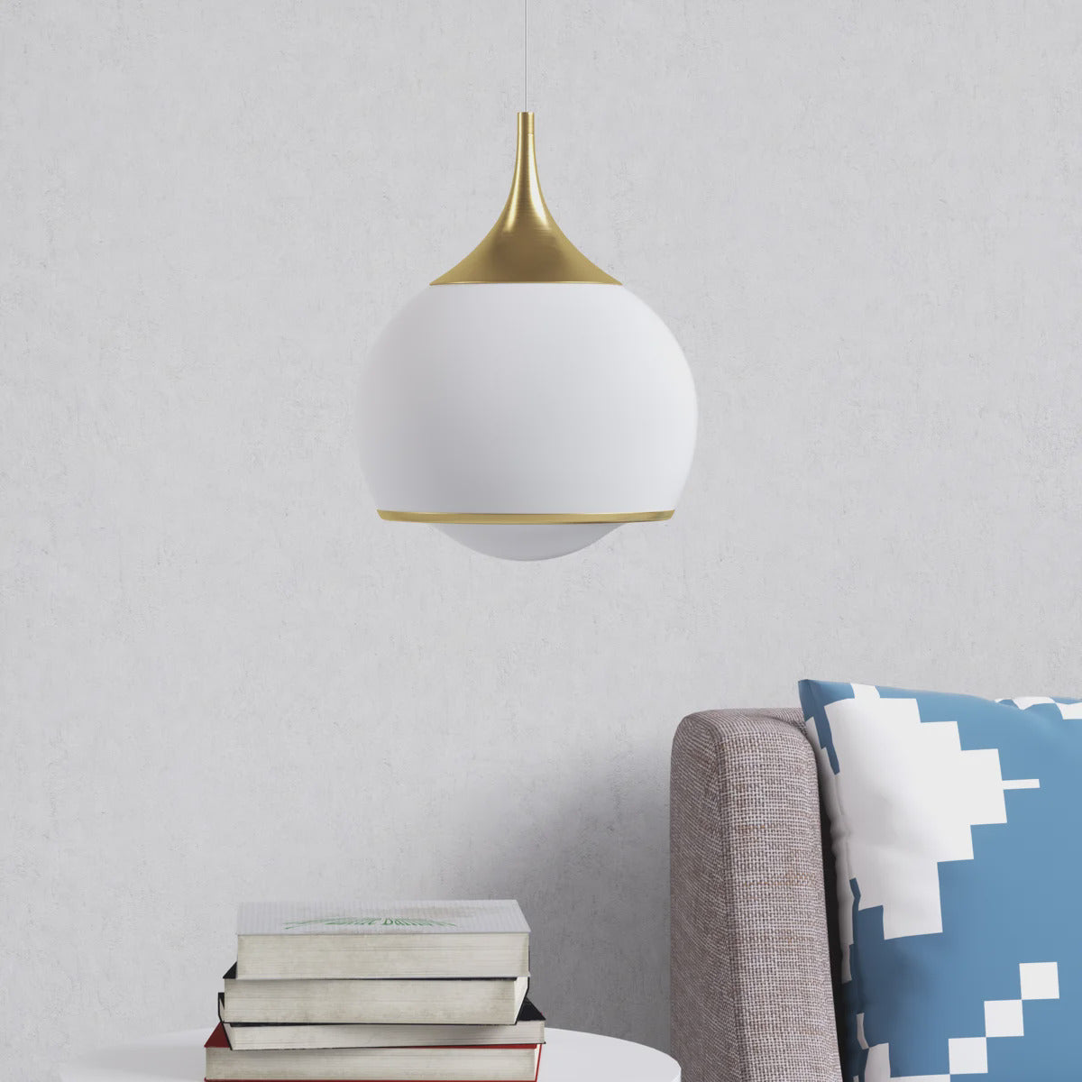 Gold Glass Integrated LED Pendant Light — lit above a side table
