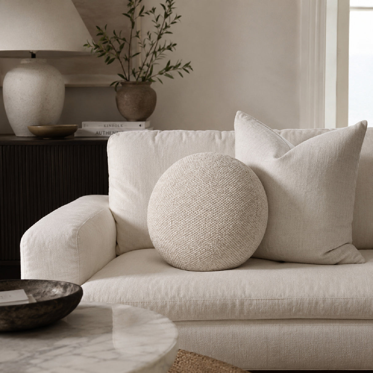 Round Minimalist Pillow | Living Essentials Sphere – angled view