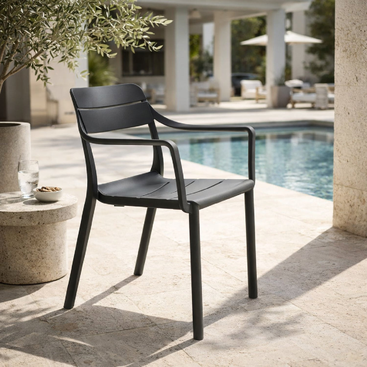 Regenerated Fiberglass Outdoor Dining Armchair – Cassia – outdoor angled view