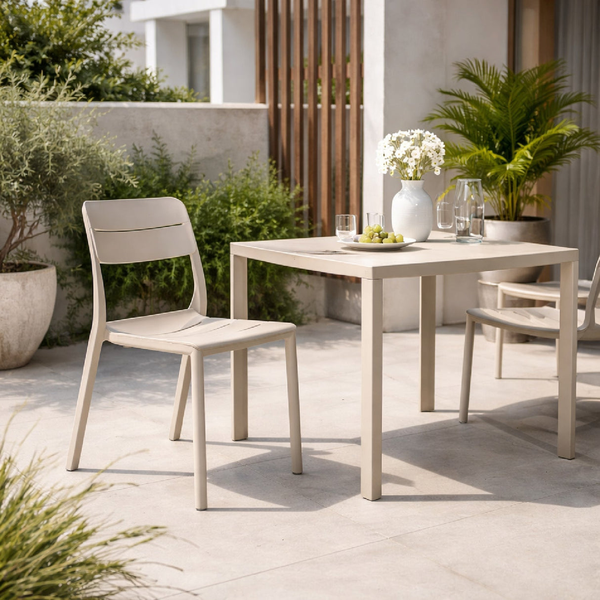 Fiberglass Outdoor Monobloc Dining Chair – Cassia Bistrot – outdoor angled view