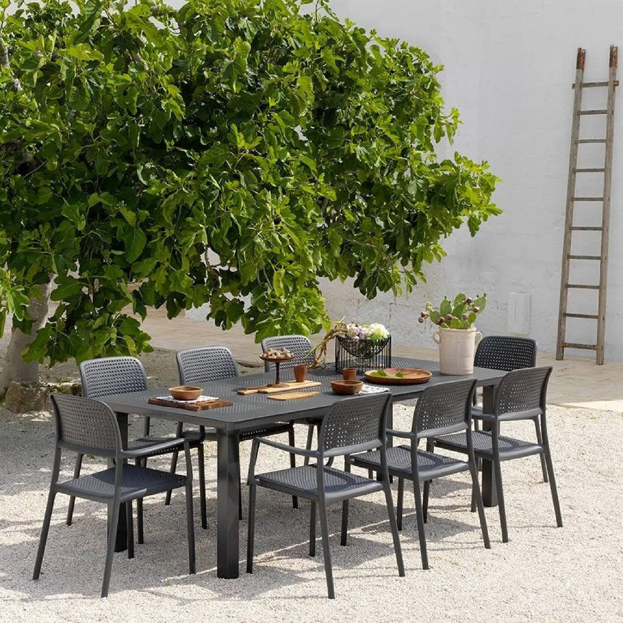 Perforated Fiberglass Outdoor Dining Armchair – Bora – outdoor angled view