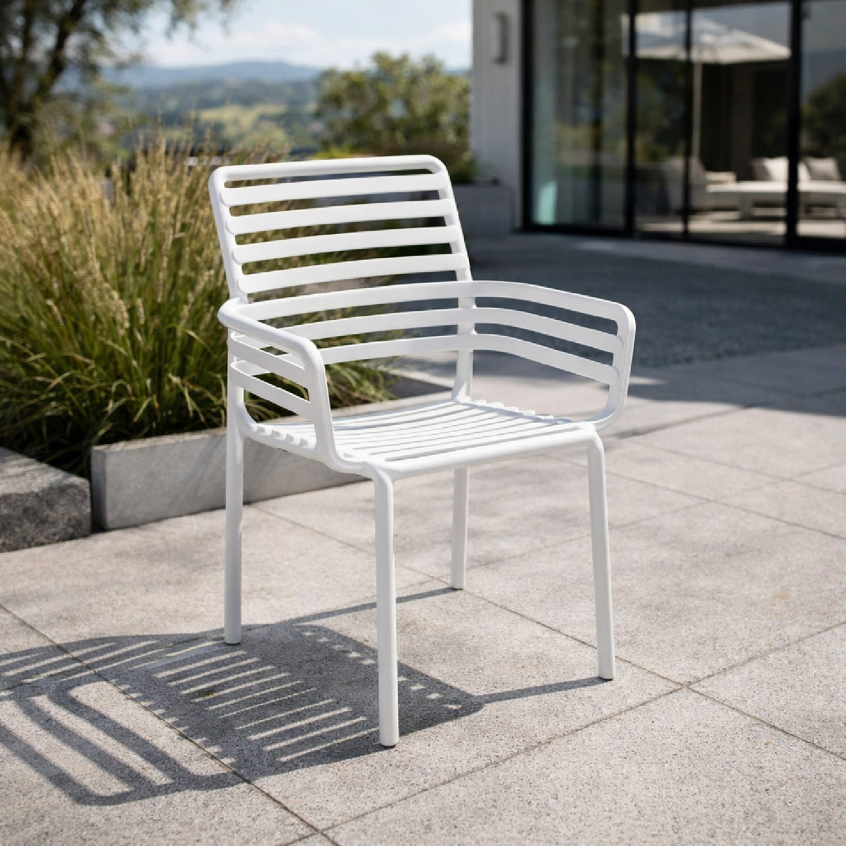Slatted Outdoor Monobloc Dining Armchair – Doga – outdoor angled view