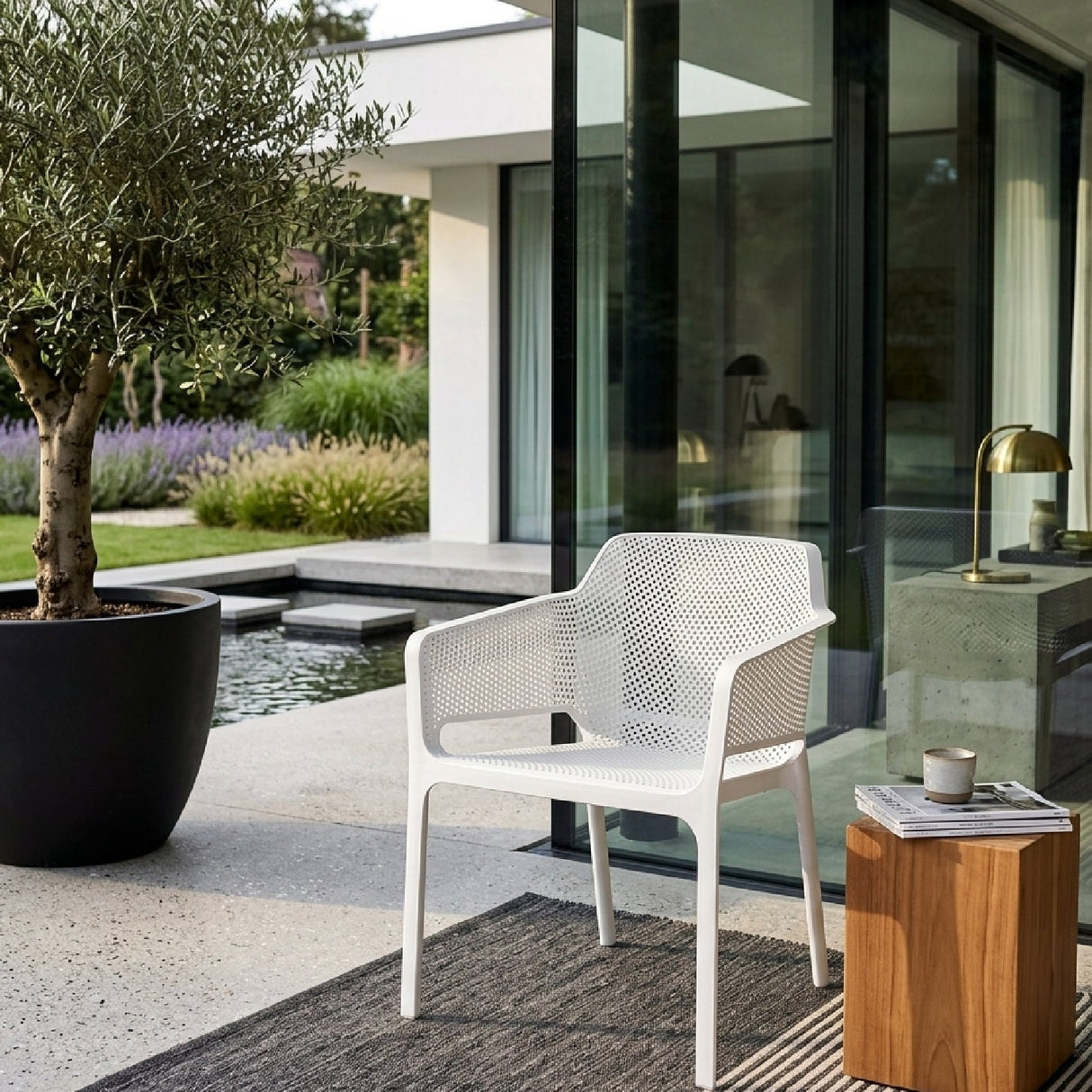 Square Perforated Outdoor Dining Armchair – Net – outdoor angled view