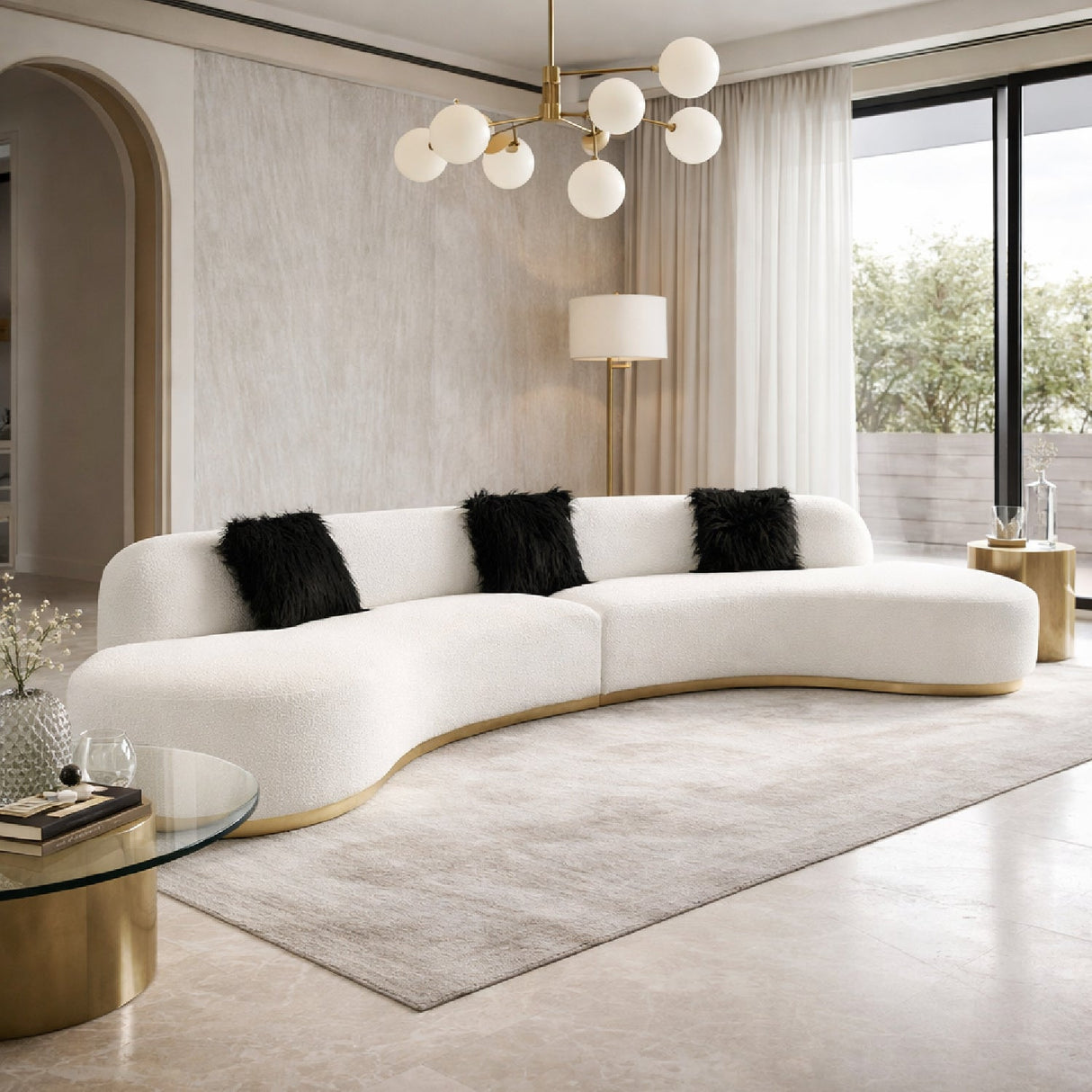 White Curved Sofa with Black Pillows – Frontier – angled view