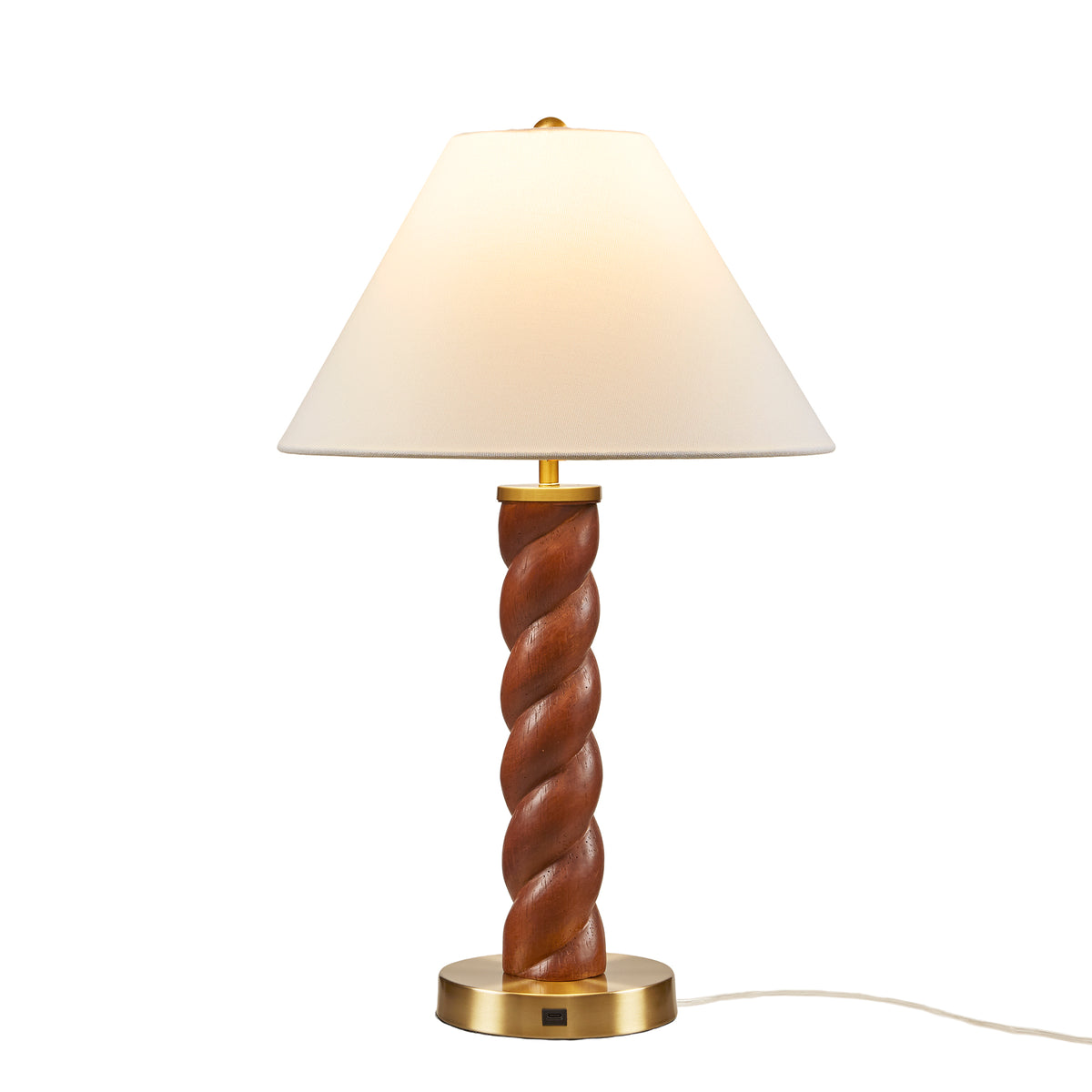 Table lamp with wooden spiral base and white shade on a white background
