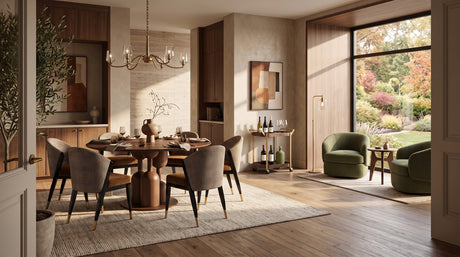 Modern dining room in warm autumn tones with a sculptural wood table, upholstered chairs and olive green armchairs.