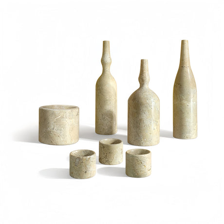 Set of stone-like bottles and cups on a white background