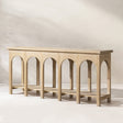 Natural Reclaimed Elm Console Table with Arched Base — against a living-room wall
