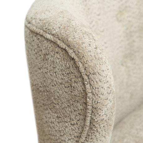 Generously proportioned and upholstered in warm camel fabric, this loveseat-