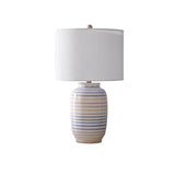 Striped glazed ceramic table lamp with white drum shade — front view