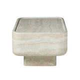 Low, clean-lined, and quietly sculptural, this rectangular coffee table brings the look of natural travertine to contemporary living spaces. 