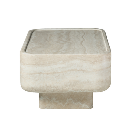 Low, clean-lined, and quietly sculptural, this rectangular coffee table brings the look of natural travertine to contemporary living spaces. 
