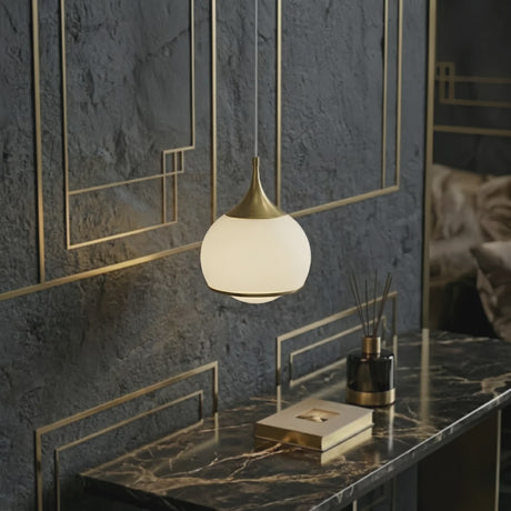 Gold Glass Integrated LED Pendant Light — above a bathroom vanity
