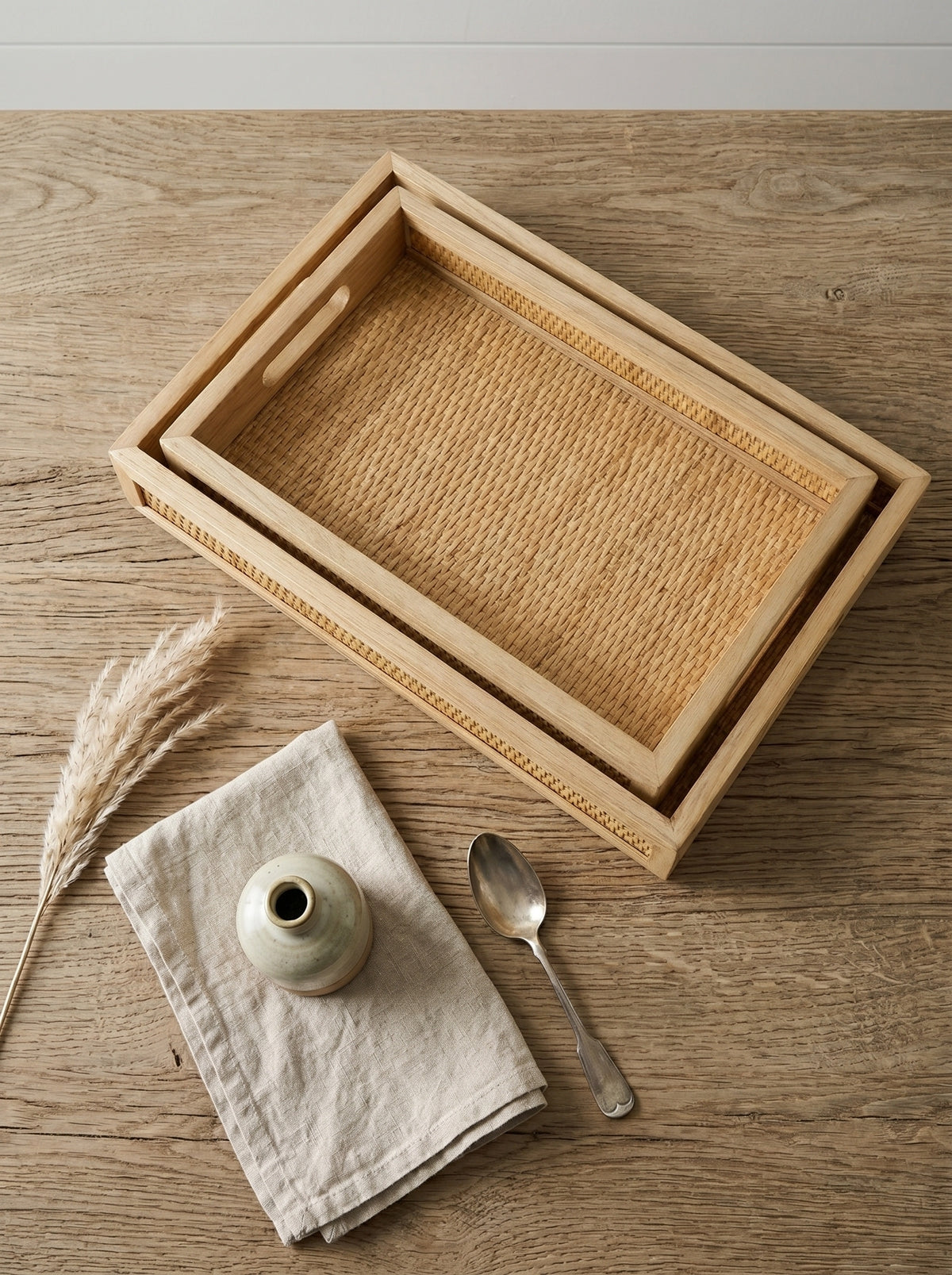 Brown Woven Rattan Trays with Handles — nested trays viewed from above