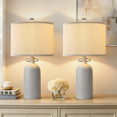 Gray Textured Ceramic Dimmable Table Lamps — lit pair on a console