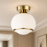 Gold Opal Glass Dimmable LED Ceiling Lamp — lit globe close-up