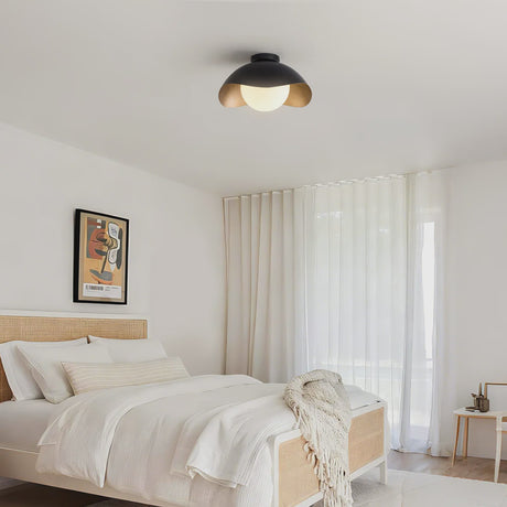 Matte Black and Gold Opal Glass Ceiling Lamp — installed in a bedroom