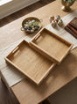 Brown Woven Rattan Trays with Handles — pair styled on a tabletop