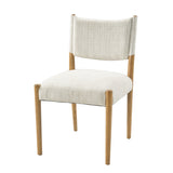 Cream Upholstered Natural Wood Dining Chairs — three-quarter view