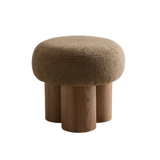Stool with brown cushioned top and wooden legs on a white background