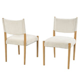 Cream Upholstered Natural Wood Dining Chairs — two chairs in three-quarter view