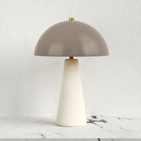 Off-White Ceramic Mushroom Table Lamp — on a marble surface