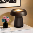 Black Ceramic Rechargeable LED Table Lamp — lit on a console