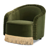 An olive green velvet barrel chair with a beige fringed skirt, shown on a solid white background.