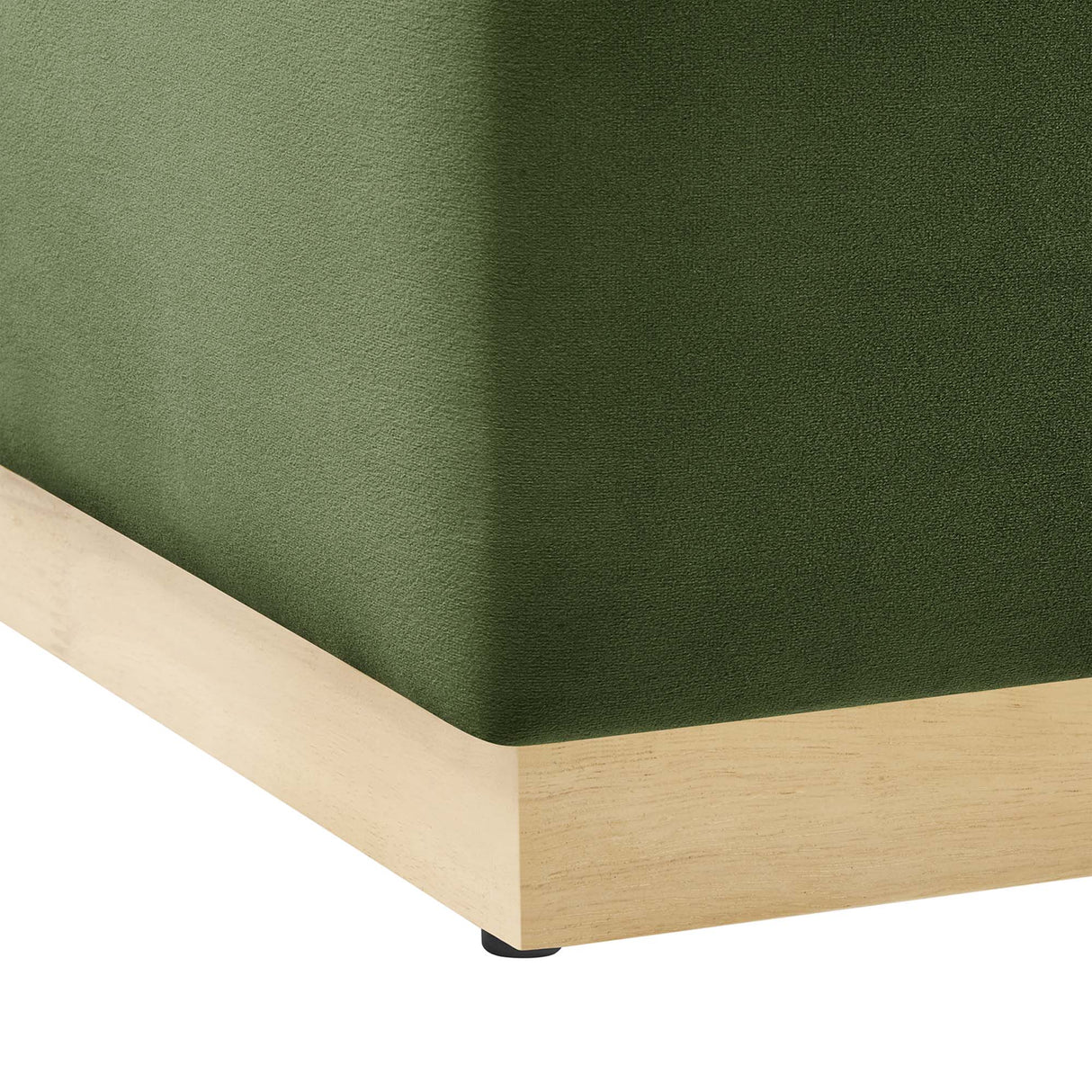 Green fabric fitted sheet on a wooden bed frame