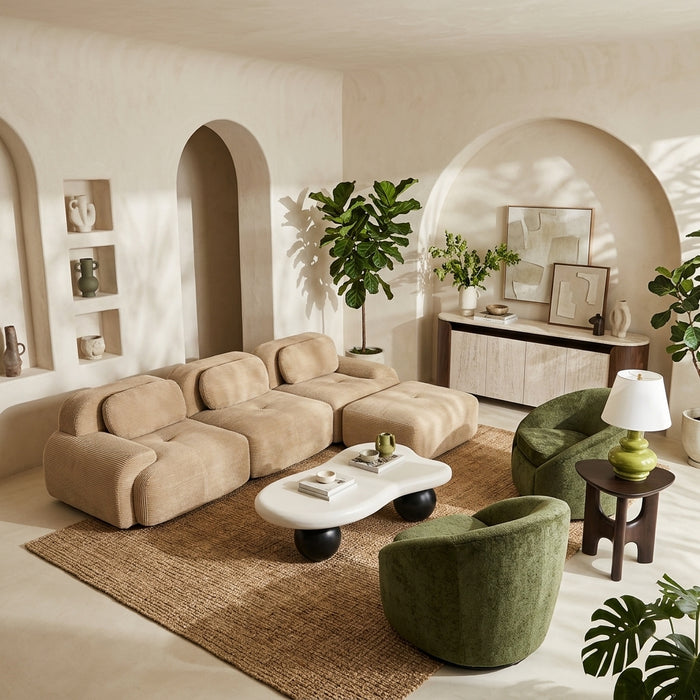 OROA L-shaped sofa in a Curved & Organic Modern living room with warm wood, natural stone, curved walls, earthy accents, and layered architectural details.
