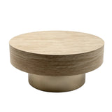 A modern round coffee table with a light beige wood-grain top and a brushed gold metal pedestal base.