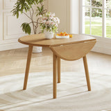 Natural Birch Veneer Round Drop-Leaf Dining Table — in a dining nook with one leaf lowered