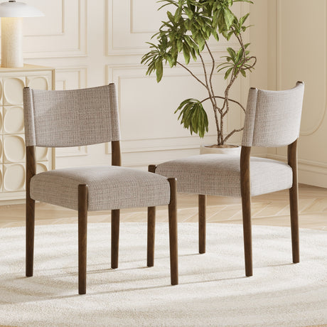 Upholstered dining chair with walnut-finish legs — beside a dining table