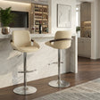 Cream Faux Leather Adjustable Swivel Barstools — pair at a kitchen counter