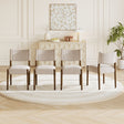 Upholstered dining chair with walnut-finish legs — set arranged in a dining room