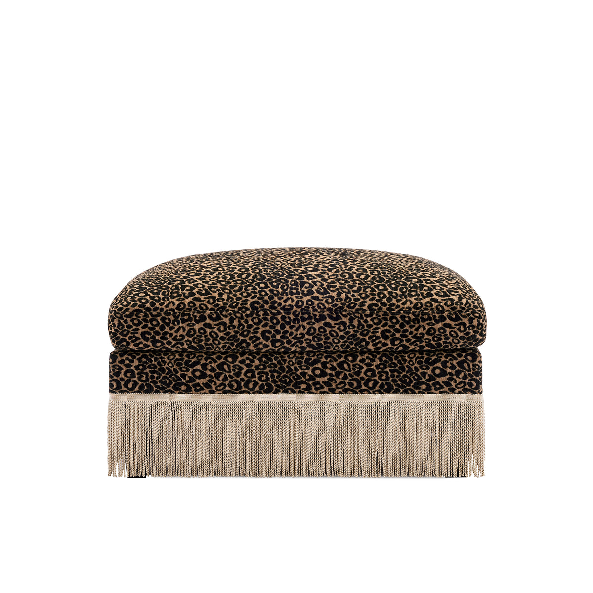 A square ottoman with a leopard print velvet top and a long fringe base, shown against a plain white background.