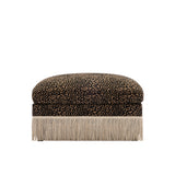 A square ottoman with a leopard print velvet top and a long fringe base, shown against a plain white background.