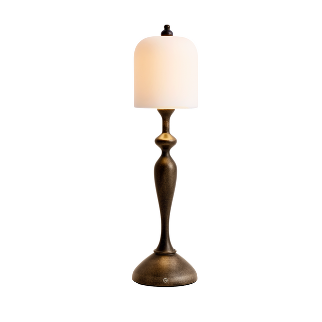 Antique bronze table lamp with white ceramic shade — lit front view