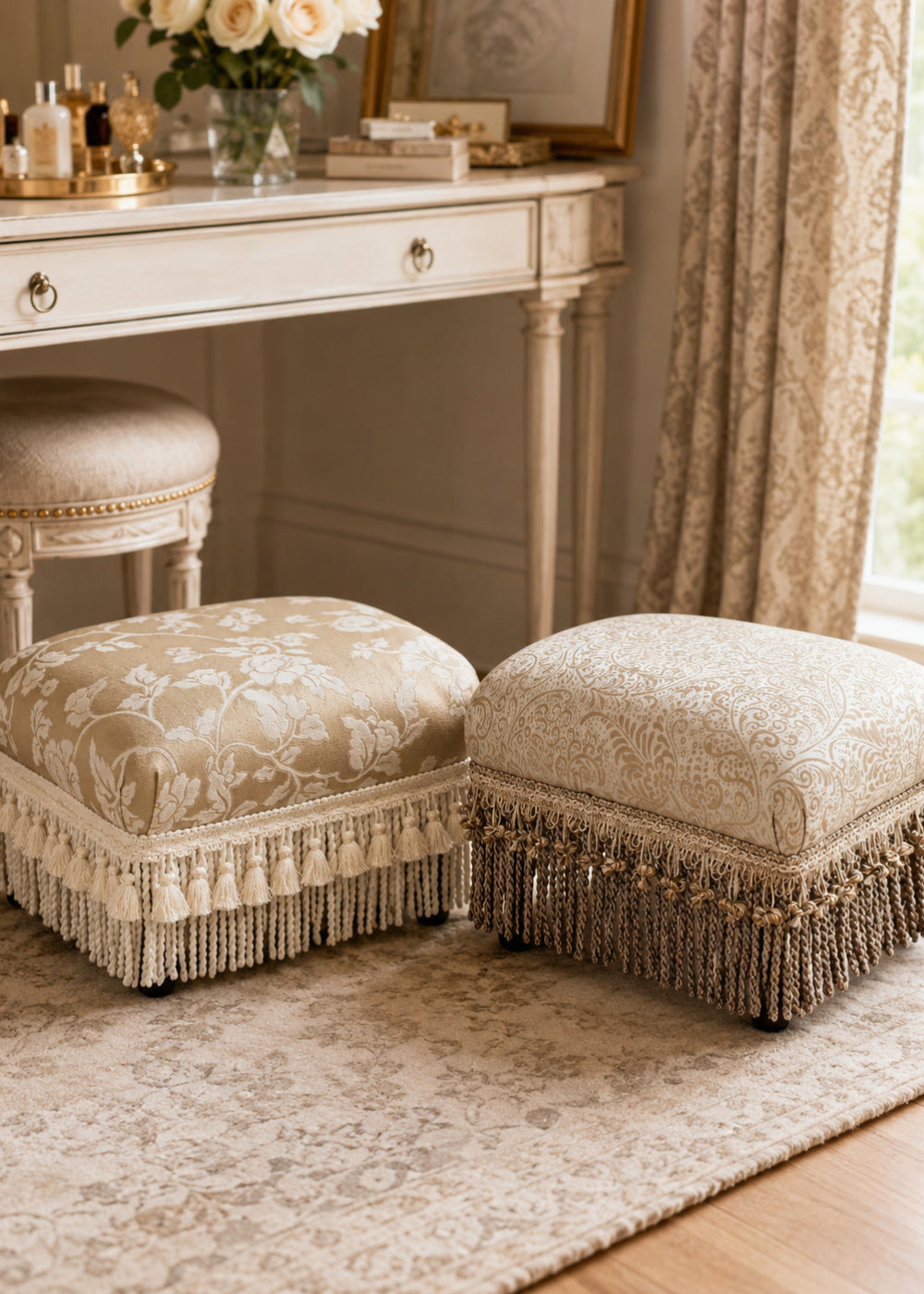 upholstered ottomans with floral damask fabric and fringe trim