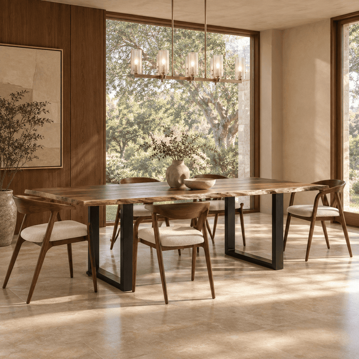 Quiet Luxury dining room featuring a rectangular six-seat solid wood dining table with visible wood grain, warm ivory plaster, rich wood architecture, natural stone flooring, and bright daylight.
