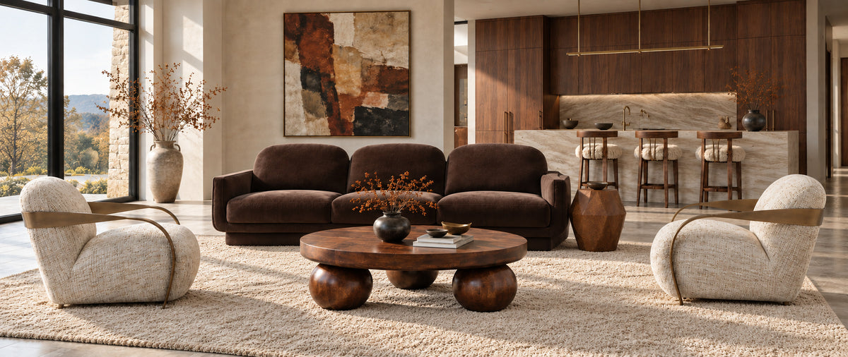 Warm modern living room with sculptural designer seating and wood coffee tables for the OROA Fall Design Sale