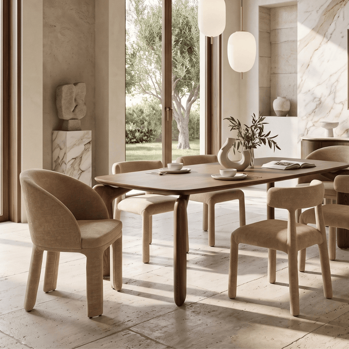 A mix of OROA host and side chairs brings visual variety to this warm minimalism dining room, balancing coordinated forms with distinct seating styles.
